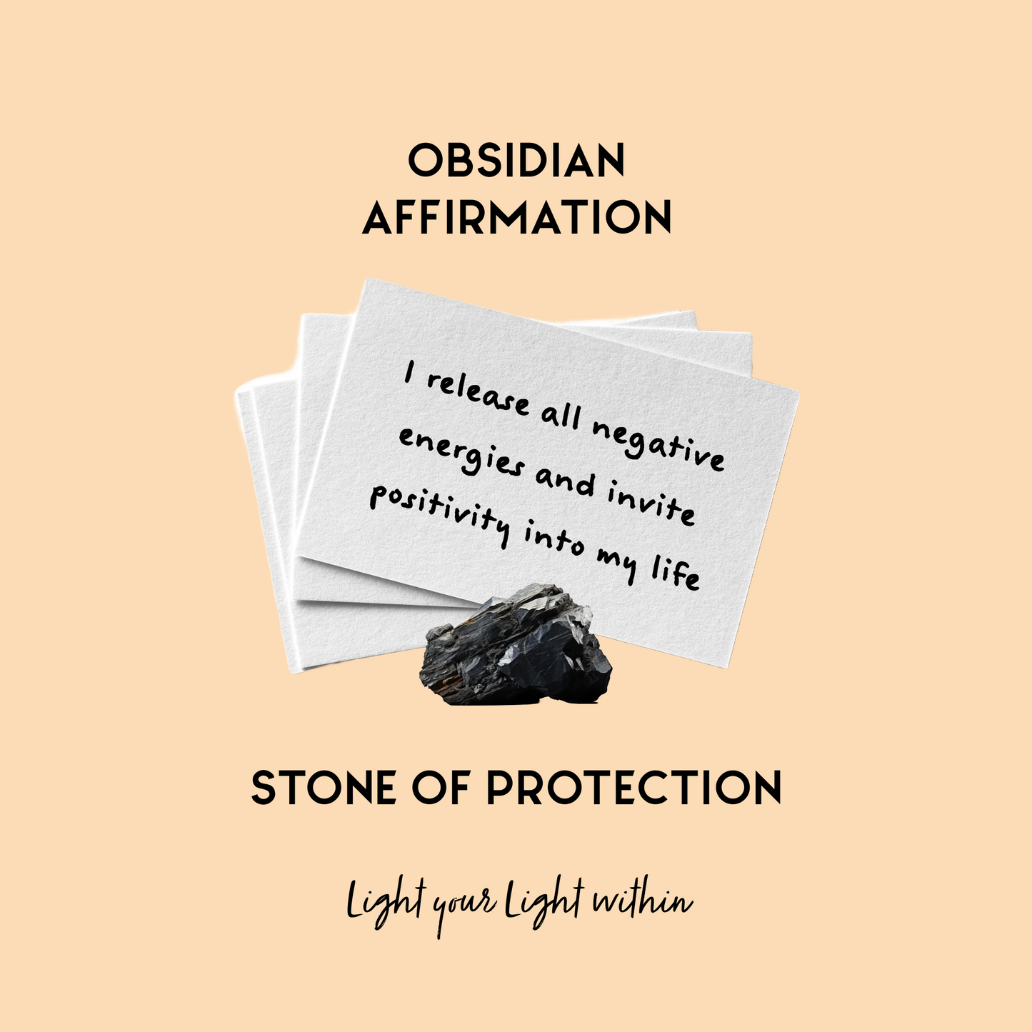 Image of Obsidian Affirmation Cards held together with a Obsidian crystal the affirmation reads:I release all negative energies and invite positivity into my life. 