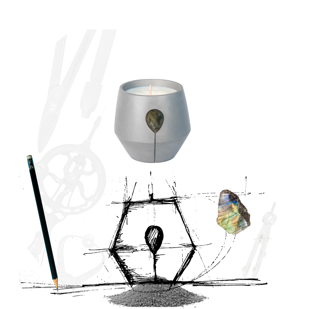 An image of Luna Coast candle, with a drawing of the first design of Luna jars, and the tools used to create the final vessel, a raw Labradorite gemstone is also shown to illustrate how the jars are adorned with natural earth crystals. 