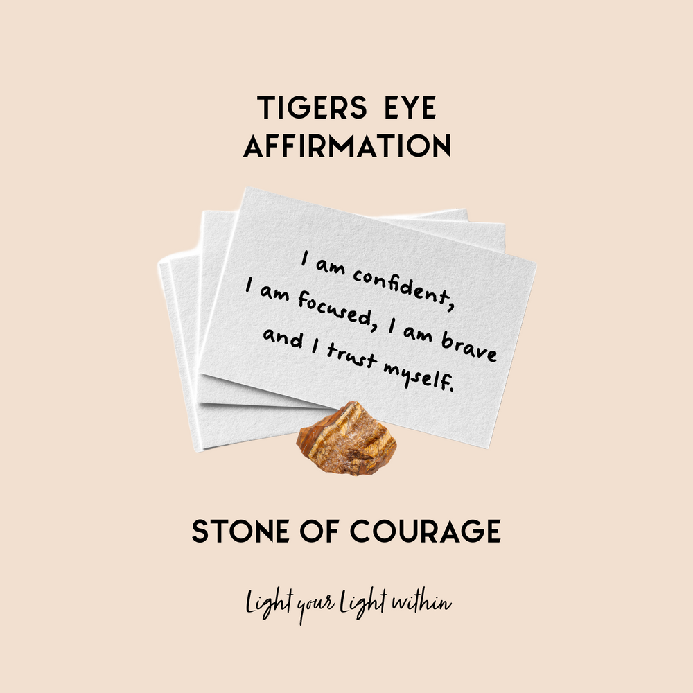Image of Tigers Eye Affirmation Cards held together with a Tigers Eye crystal the affirmation reads: I am confident, I am focused, I am brave and I trust myself. 